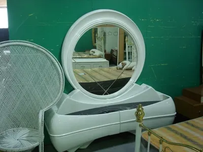 Round carved wall mirror by KABEER TRADING CO.