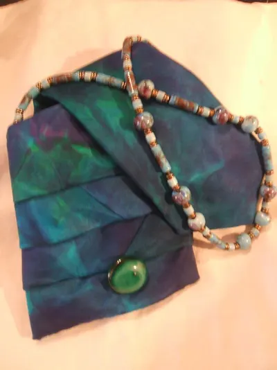 Coloured coconut shell necklace with earrings by Miral India